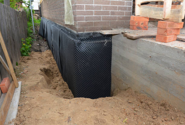 SJ Waterproofing Pros technician performing targeted Emergency Waterproofing assessment in Minnetonka, MN